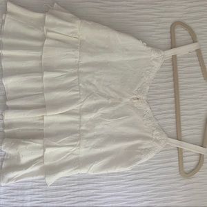 White blouse with some buttons.